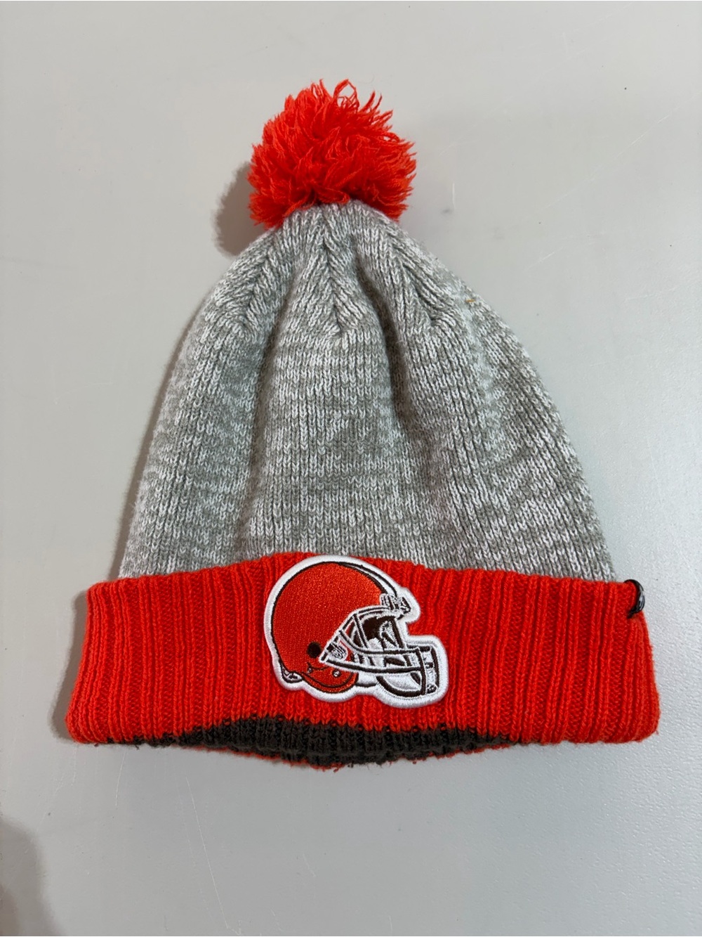 47 Cleveland Browns Brown and Orange Pom Cuffed Beanie with Helmet Logo